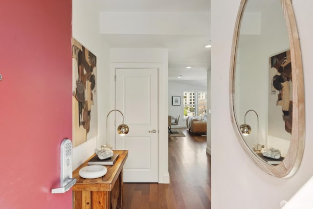 hall with wood finished floors and recessed lighting