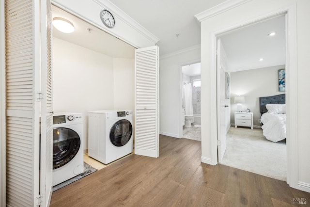 110 Baypoint Dr, San Rafael, CA 94901 - laundry room featuring washer and clothes dryer, wood finished floors, ornamental molding, baseboards, and recessed lighting