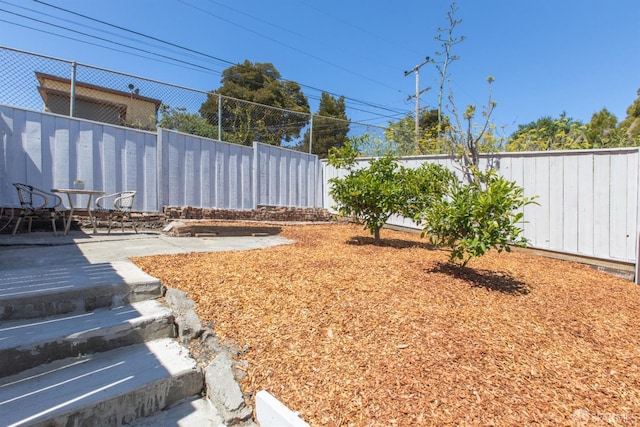 939 Innes Ave, San Francisco, CA 94124 - fenced backyard with a patio area