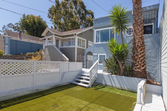939 Innes Ave, San Francisco, CA 94124 - rear view of property with stairway and stucco siding