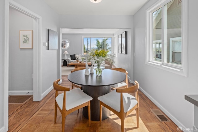 939 Innes Ave, San Francisco, CA 94124 - dining space featuring light wood finished floors and a desk