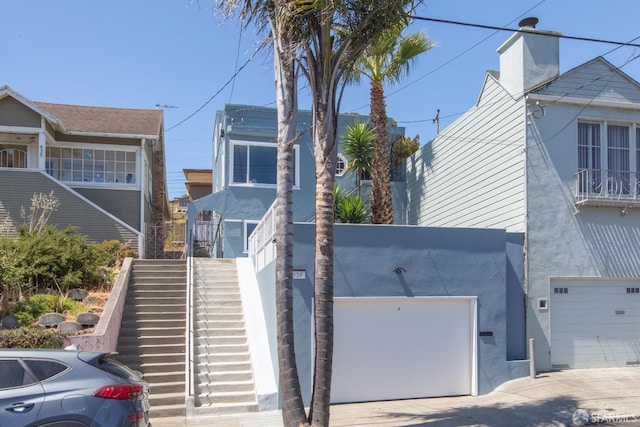 939 Innes Ave, San Francisco, CA 94124 - view of front of property featuring stairway and stucco siding