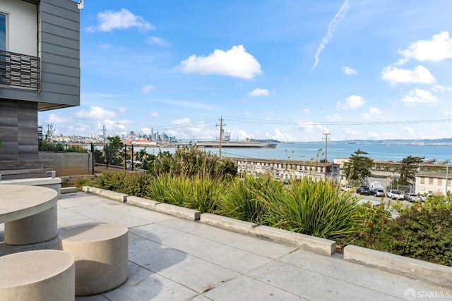 view of patio / terrace with a water view