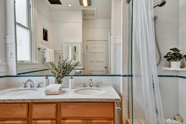 bathroom with vanity and walk in shower