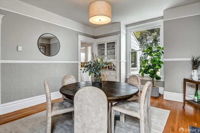 dining space featuring hardwood / wood-style floors