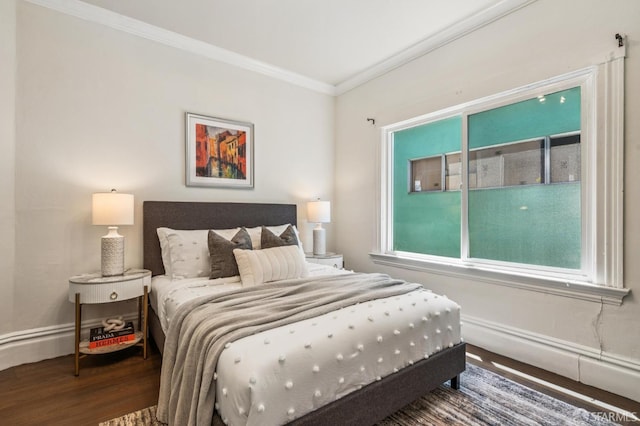 882 56th St, Oakland, CA 94608 - bedroom with crown molding, wood finished floors, and multiple windows
