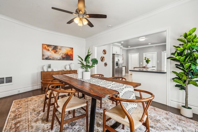 882 56th St, Oakland, CA 94608 - dining room with ceiling fan, crown molding, and wood finished floors
