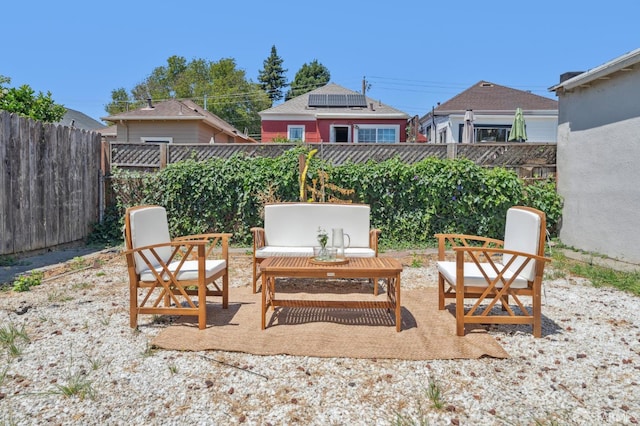 882 56th St, Oakland, CA 94608 - fenced backyard with a patio and an outdoor hangout area