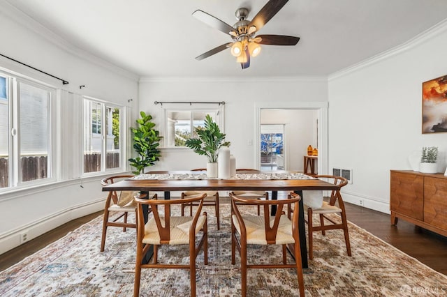 882 56th St, Oakland, CA 94608 - dining area featuring dark wood-style floors, crown molding, and a ceiling fan