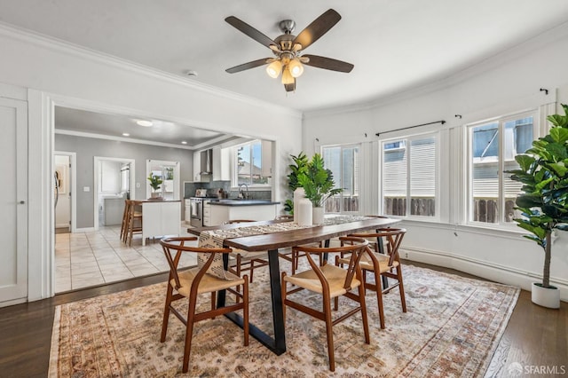 882 56th St, Oakland, CA 94608 - dining area featuring ornamental molding, a ceiling fan, and light wood-type flooring