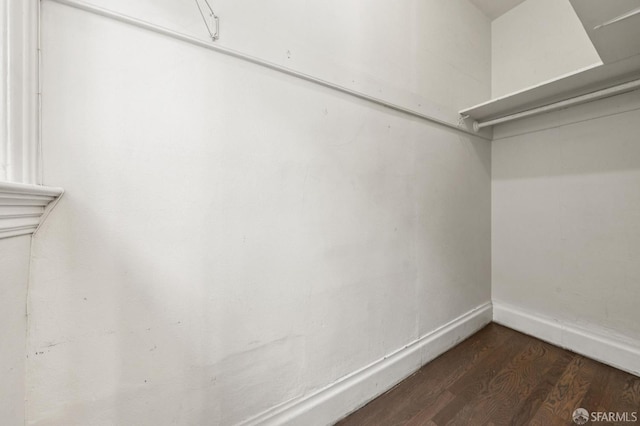 882 56th St, Oakland, CA 94608 - walk in closet featuring dark wood finished floors