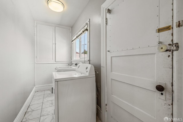 882 56th St, Oakland, CA 94608 - laundry area with light marble finish flooring and independent washer and dryer
