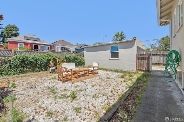 882 56th St, Oakland, CA 94608 - fenced backyard featuring a patio area