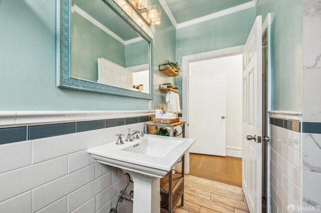 882 56th St, Oakland, CA 94608 - bathroom featuring crown molding and wood finished floors