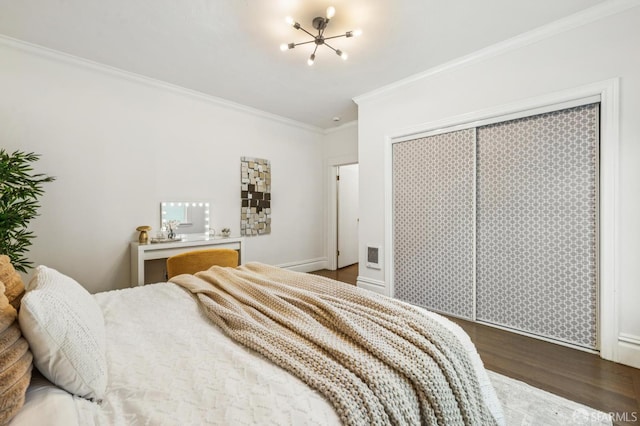 882 56th St, Oakland, CA 94608 - bedroom featuring ornamental molding, wood finished floors, and a chandelier