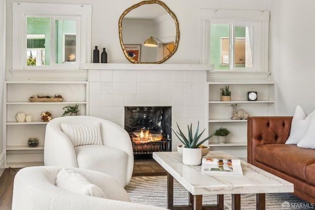 882 56th St, Oakland, CA 94608 - living area featuring wood finished floors and a fireplace