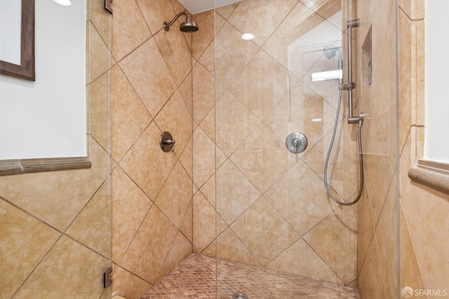 bathroom with tiled shower