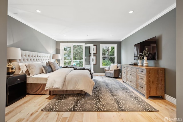 bedroom featuring crown molding and light wood-type flooring