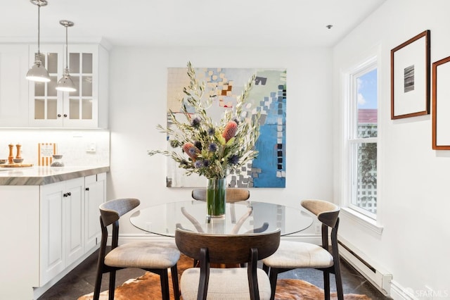 dining area with a baseboard heating unit