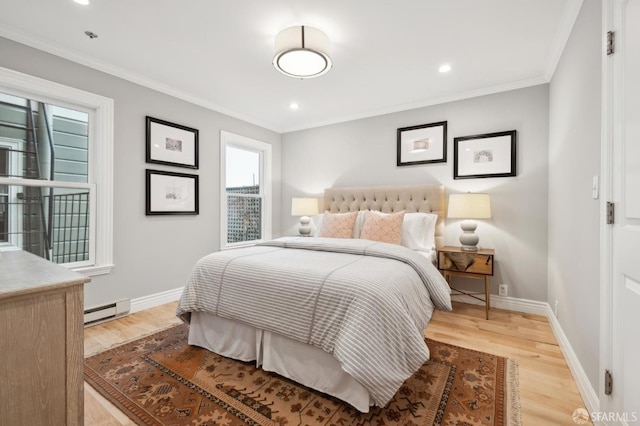 bedroom with crown molding, a baseboard radiator, and light hardwood / wood-style flooring