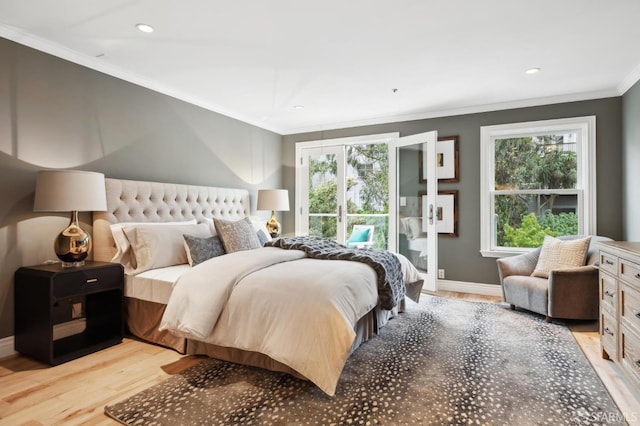 bedroom featuring crown molding and light hardwood / wood-style floors