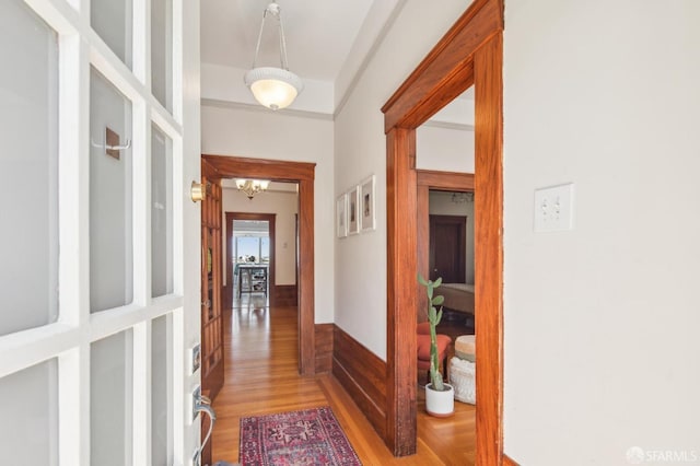 522 Liberty St, San Francisco, CA 94114 - corridor featuring an inviting chandelier and light wood-type flooring