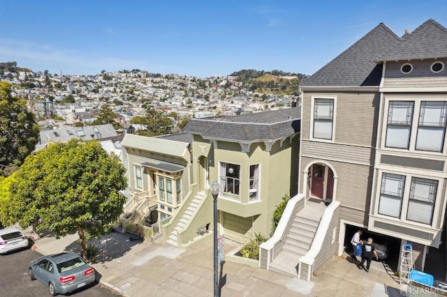 522 Liberty St, San Francisco, CA 94114 - view of front of house with stairway and roof with shingles