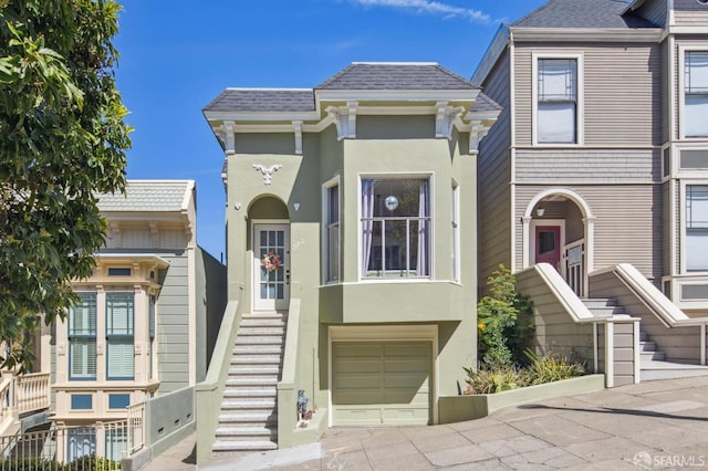 522 Liberty St, San Francisco, CA 94114 - view of front of home with stucco siding and an attached garage