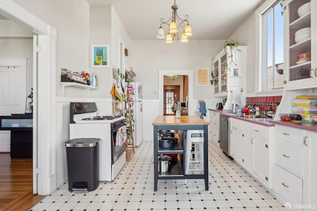 522 Liberty St, San Francisco, CA 94114 - kitchen featuring white appliances, light floors, glass insert cabinets, wainscoting, and white cabinetry
