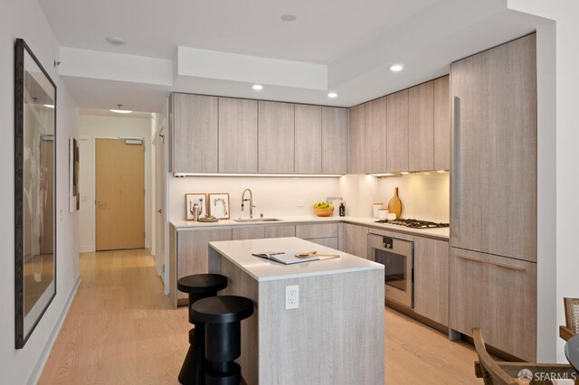 333 Beale St Unit 5I, San Francisco, CA 94105 - kitchen with modern cabinets, light brown cabinets, light wood-style floors, and recessed lighting