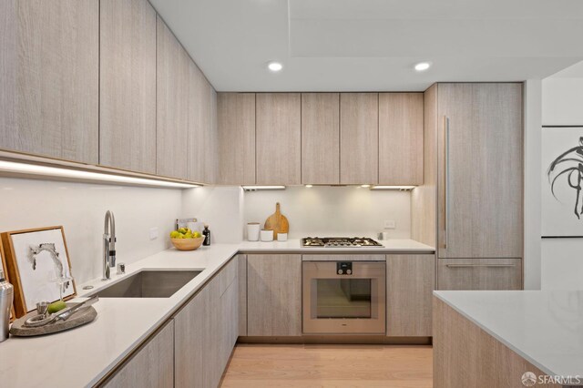 333 Beale St Unit 5I, San Francisco, CA 94105 - kitchen featuring appliances with stainless steel finishes, modern cabinets, light brown cabinets, and recessed lighting