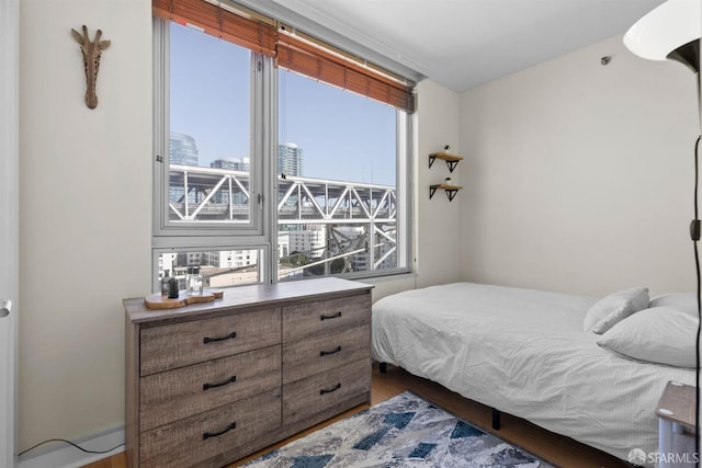 bedroom with hardwood / wood-style floors