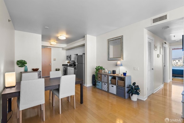 dining room featuring light hardwood / wood-style floors