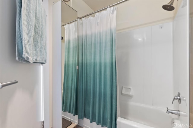 bathroom with shower / bathtub combination with curtain