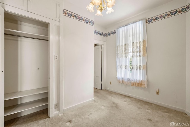 1075 Noe St, San Francisco, CA 94114 - unfurnished bedroom featuring baseboards, a closet, a chandelier, and carpet