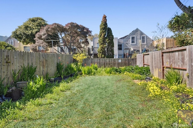 view of yard with a fenced backyard