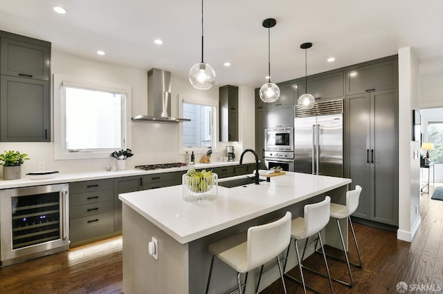 331 Vicente St, San Francisco, CA 94127 - kitchen featuring beverage cooler, wall chimney range hood, built in appliances, dark wood finished floors, and recessed lighting