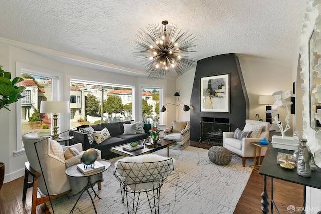 331 Vicente St, San Francisco, CA 94127 - living room featuring a textured ceiling, wood finished floors, a chandelier, vaulted ceiling, and a large fireplace
