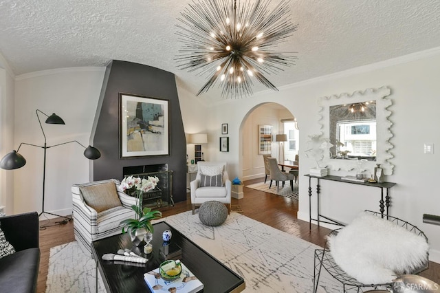 331 Vicente St, San Francisco, CA 94127 - living area with arched walkways, a chandelier, wood finished floors, a textured ceiling, and crown molding