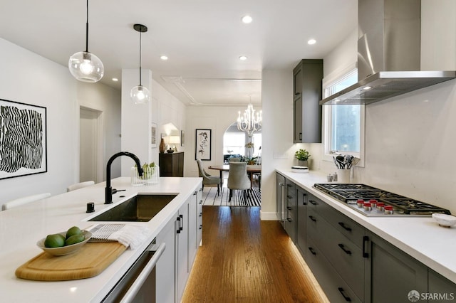 331 Vicente St, San Francisco, CA 94127 - kitchen with wall chimney exhaust hood, stainless steel appliances, dark wood-style floors, light countertops, and recessed lighting