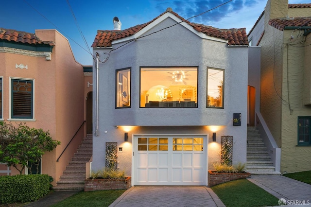 331 Vicente St, San Francisco, CA 94127 - mediterranean / spanish house featuring stairs, a tiled roof, and stucco siding