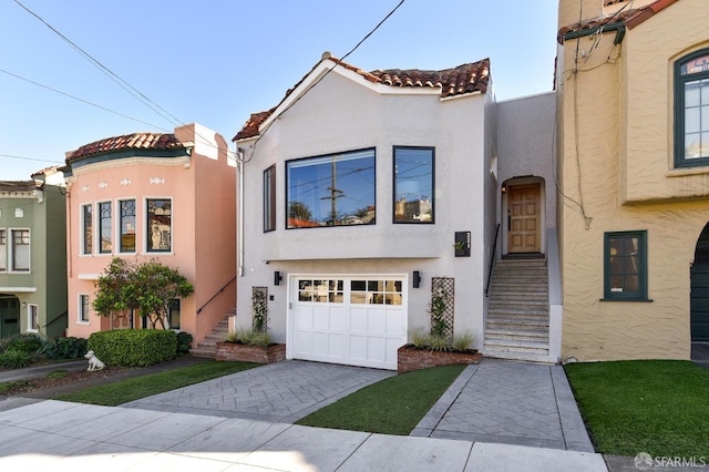 331 Vicente St, San Francisco, CA 94127 - mediterranean / spanish home featuring stucco siding, a garage, driveway, and a tile roof