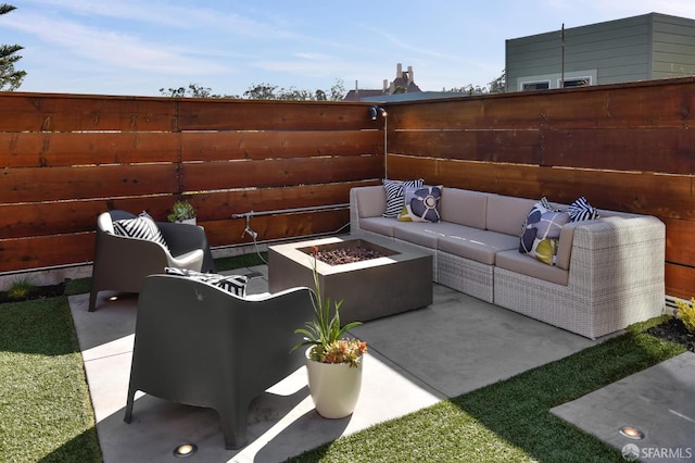 331 Vicente St, San Francisco, CA 94127 - fenced backyard featuring an outdoor living space with a fire pit and a patio area