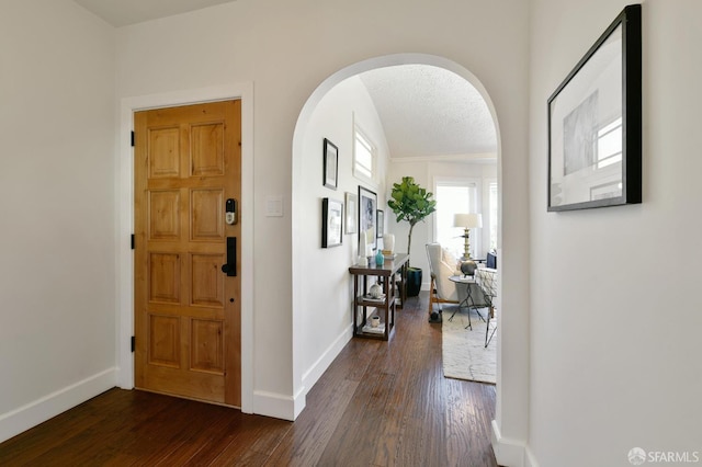331 Vicente St, San Francisco, CA 94127 - foyer with arched walkways and dark wood-style floors
