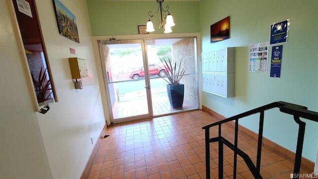 interior space featuring a chandelier and light tile patterned flooring