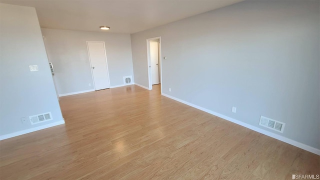 spare room with light wood-type flooring