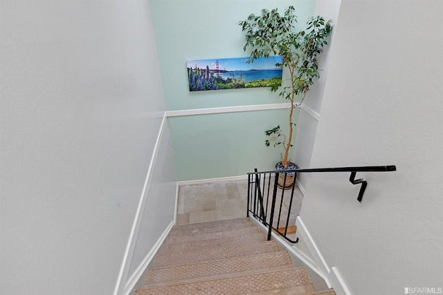 stairway featuring tile patterned floors