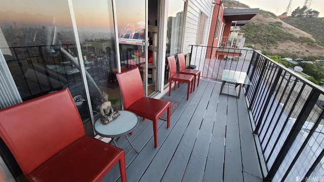 view of balcony at dusk