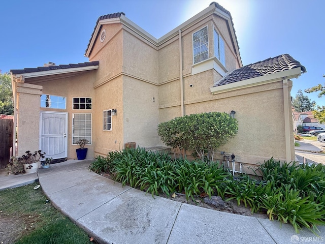 4400 Elk Dr, Antioch, CA 94531 - view of property exterior featuring stucco siding and a tiled roof