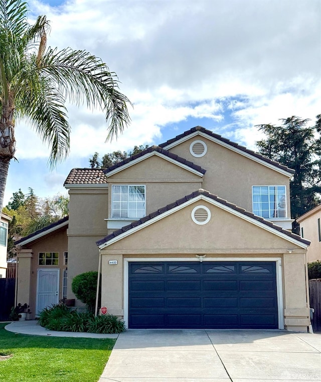 4400 Elk Dr, Antioch, CA 94531 - traditional home featuring concrete driveway, stucco siding, a tile roof, and a garage